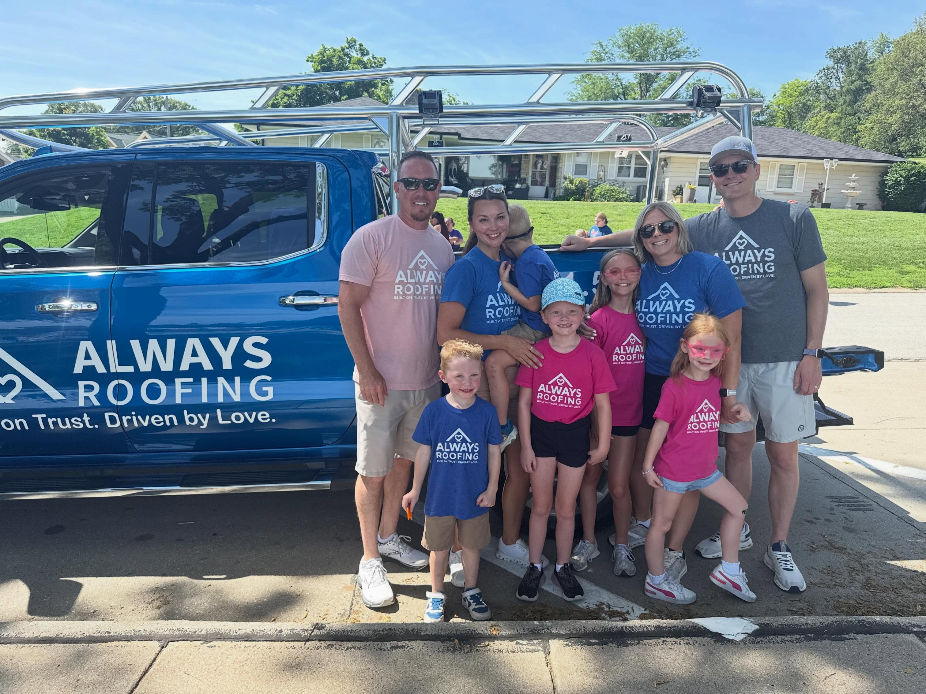 The Always Roofing family and supporters beside the company truck