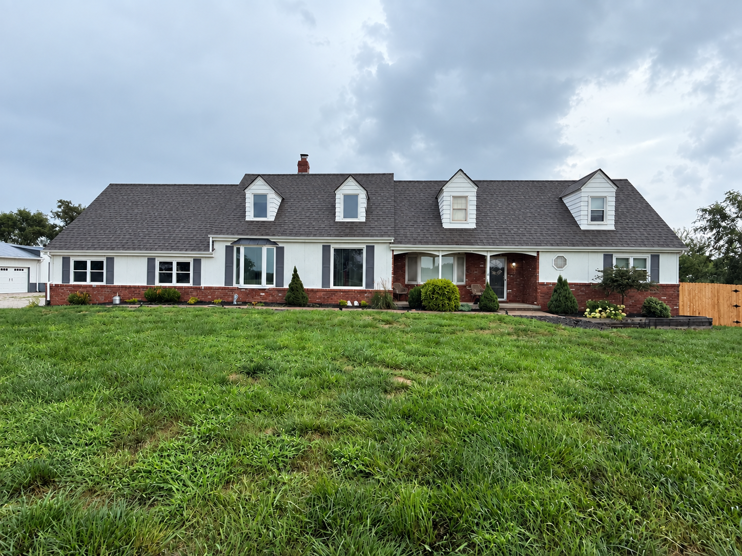 Straightened white home before roof replacement